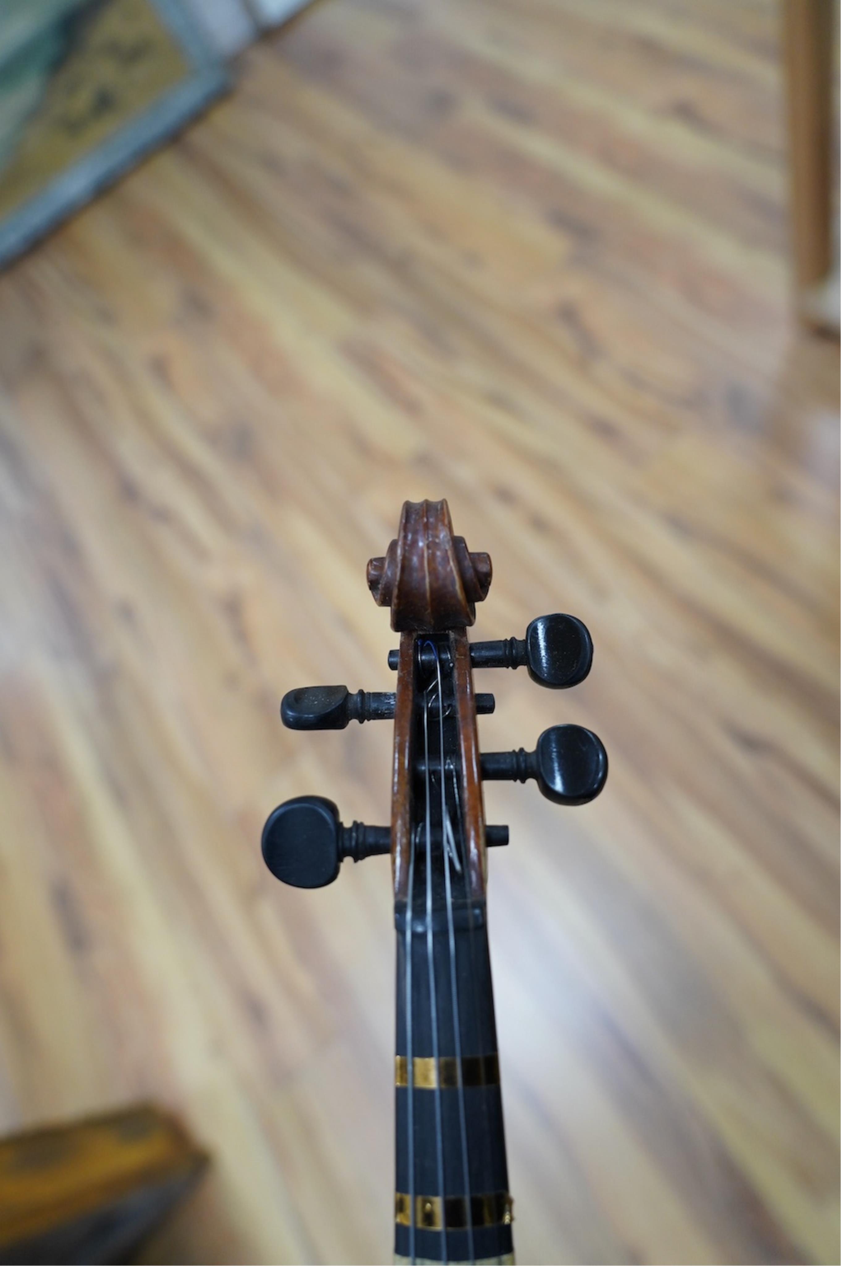 Two late 19th or early 20th century violins, one with case, back of largest measures 36cm. Condition - poor to fair